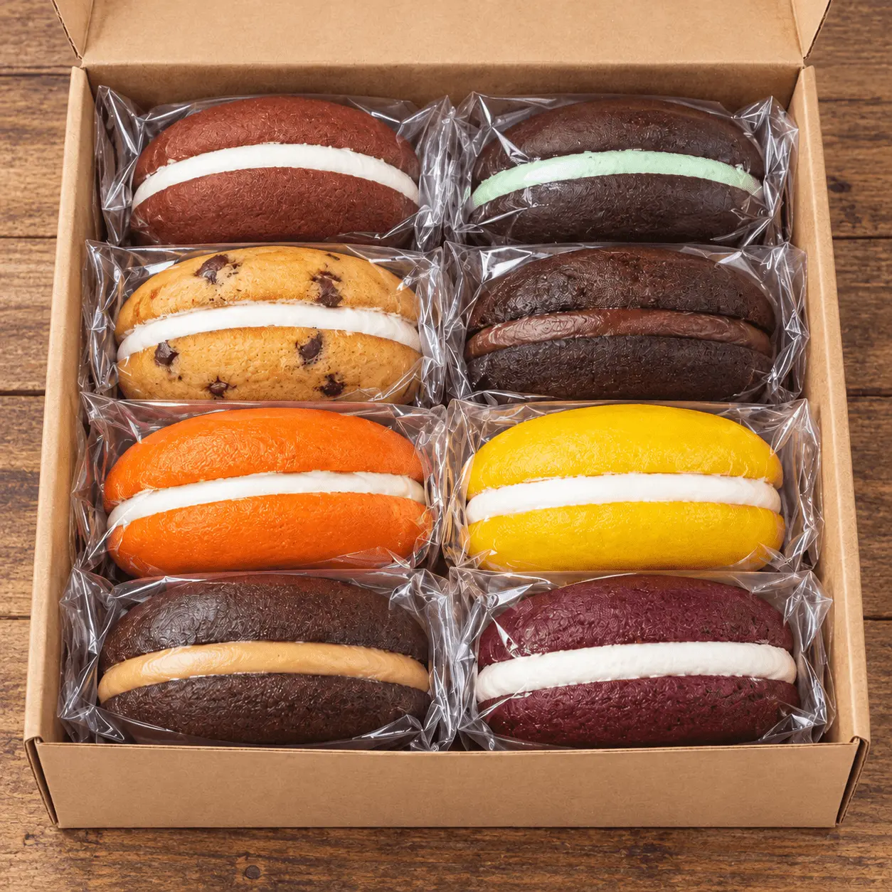 Open box of eight assorted whoopie pies in clear wrappers